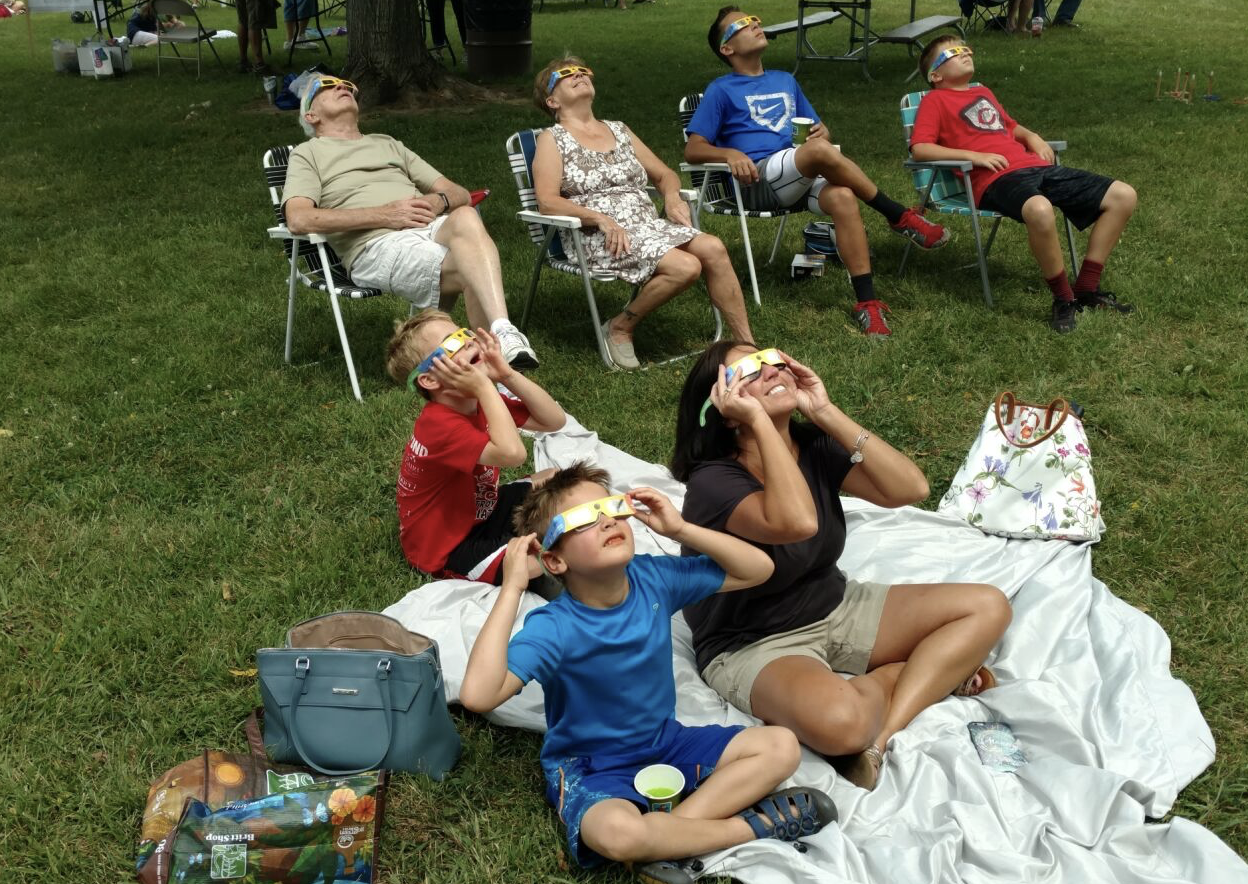 family watching eclipse