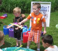 campers at water camp playing with bubbles