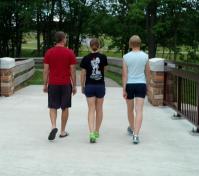 family on Shook bridge on bikeway