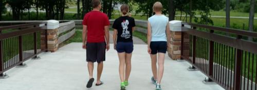 family on Shook bridge on bikeway